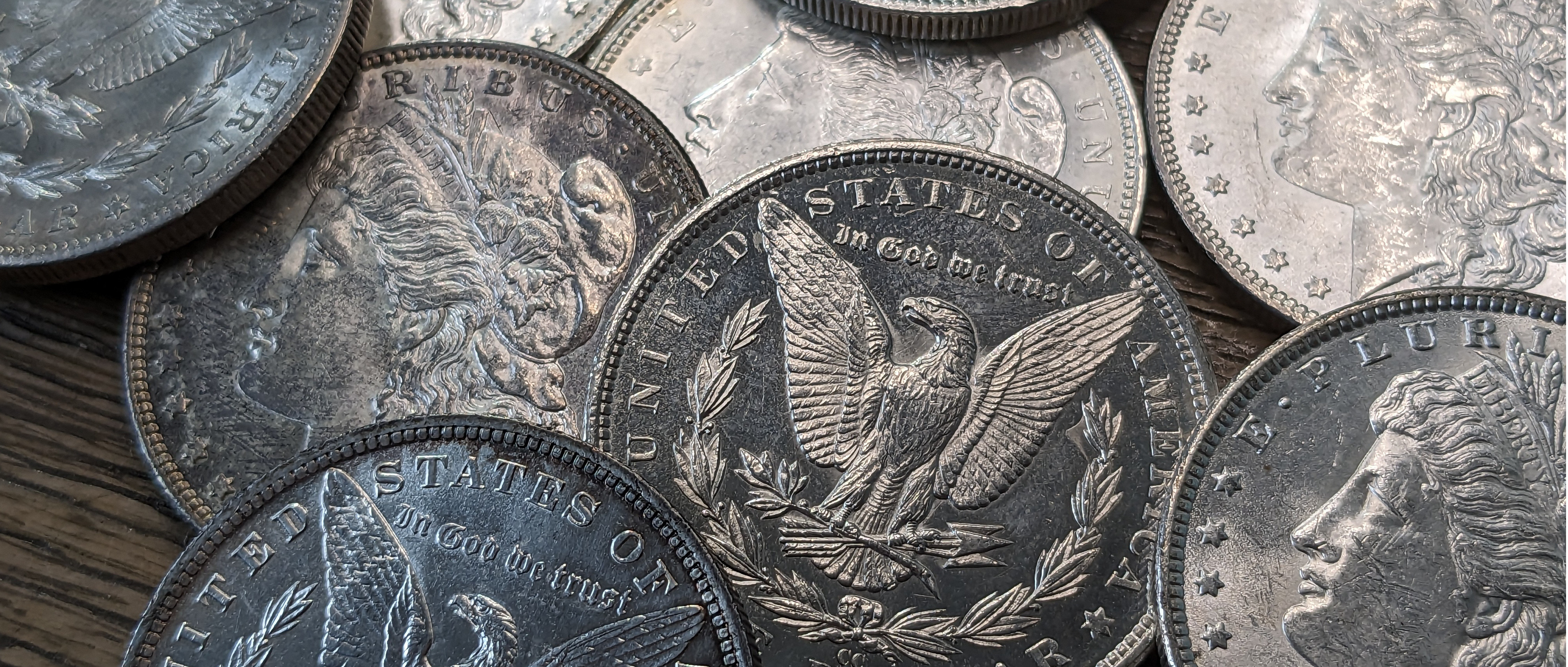 Uncirculated Morgan Silver Dollars on a desk